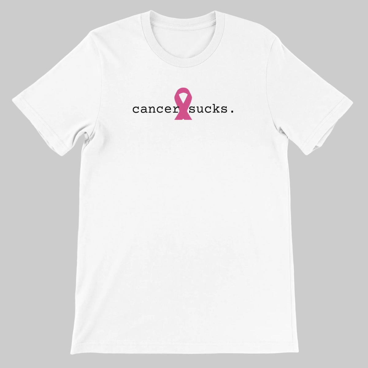 A white short-sleeve crewneck t-shirt with a graphic on the chest that reads 'cancer sucks.' in black lowercase text, where the letter 'i' is replaced by a pink awareness ribbon.