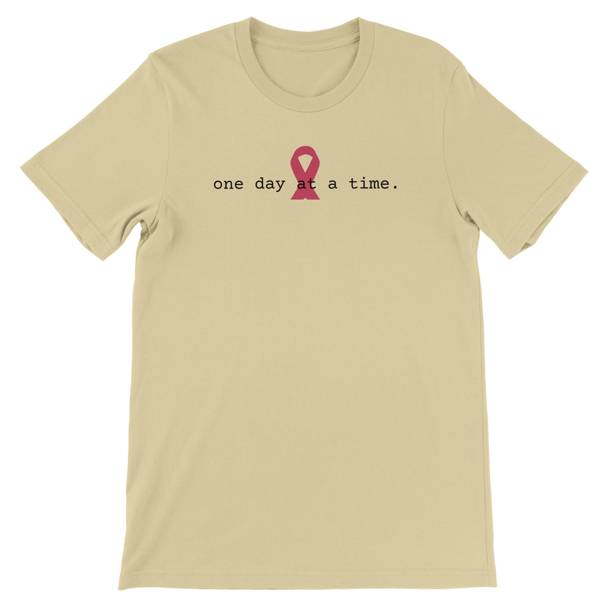 A  natural colored t-shirt with a pink awareness ribbon and the text 'one day at a time.'