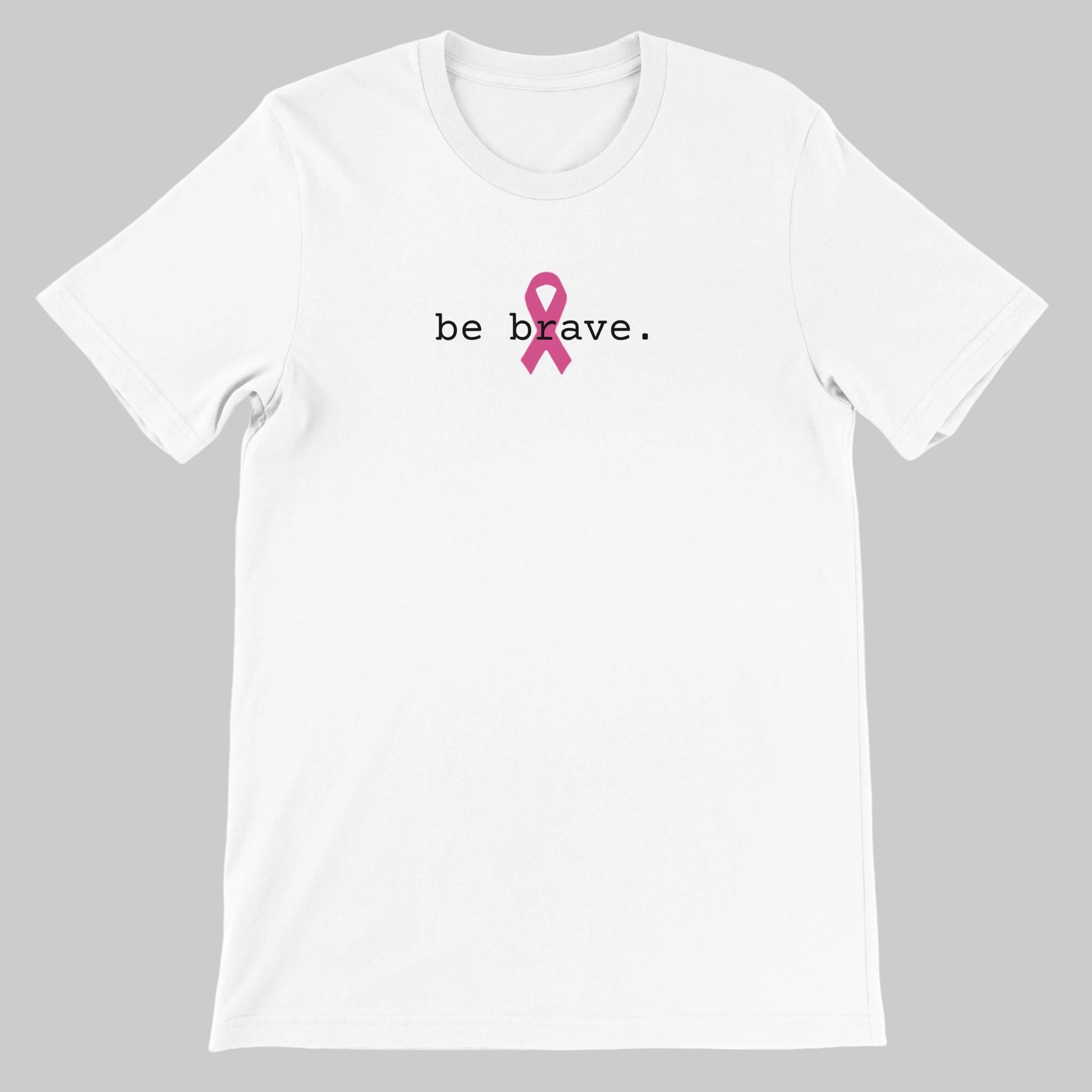 White-coloured T-shirt, front, be brave. text with pink ribbon on a warm grey background