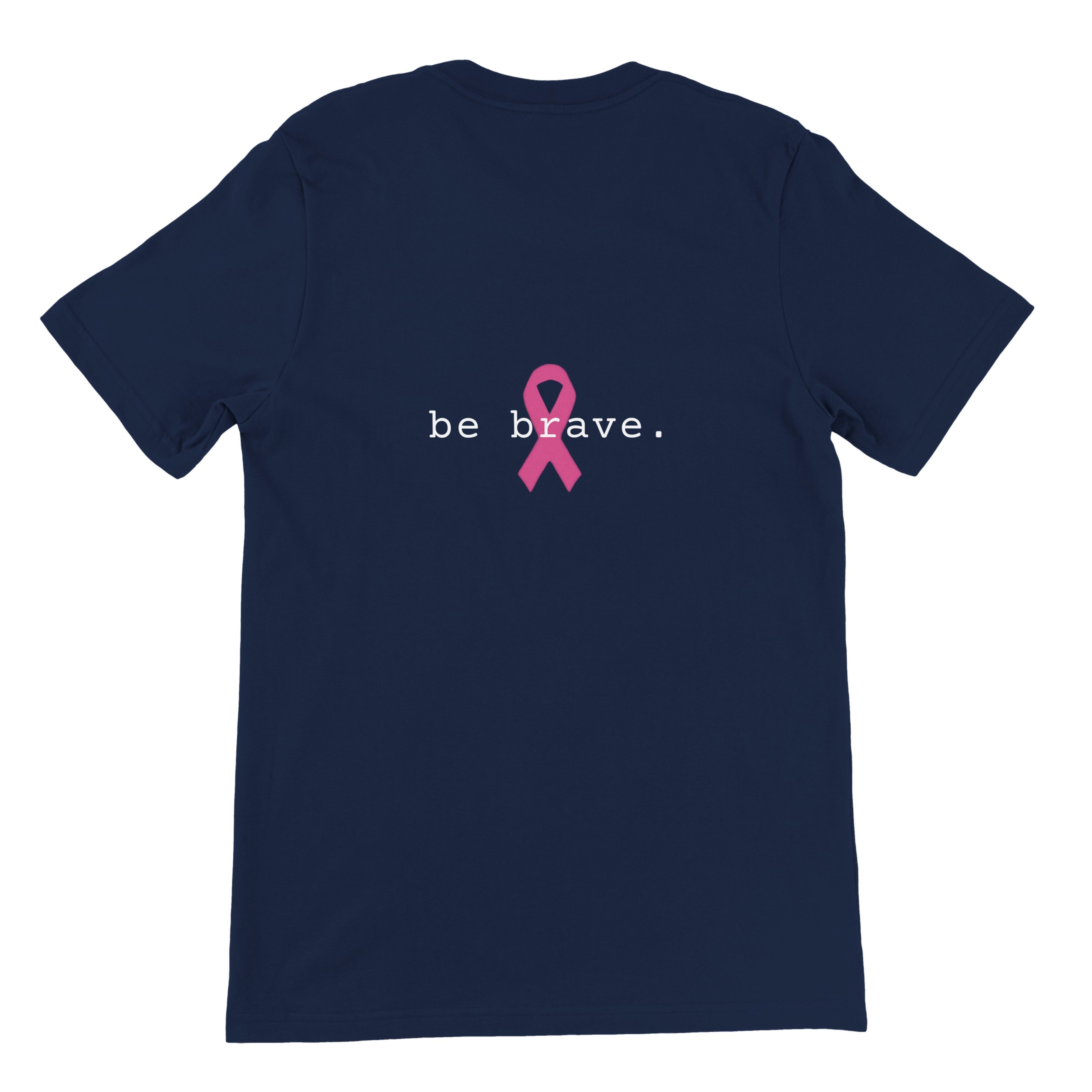 A classic navy short-sleeve t-shirt is shown from the back, featuring the text 'be brave.' in black with a pink awareness ribbon graphic in the center.