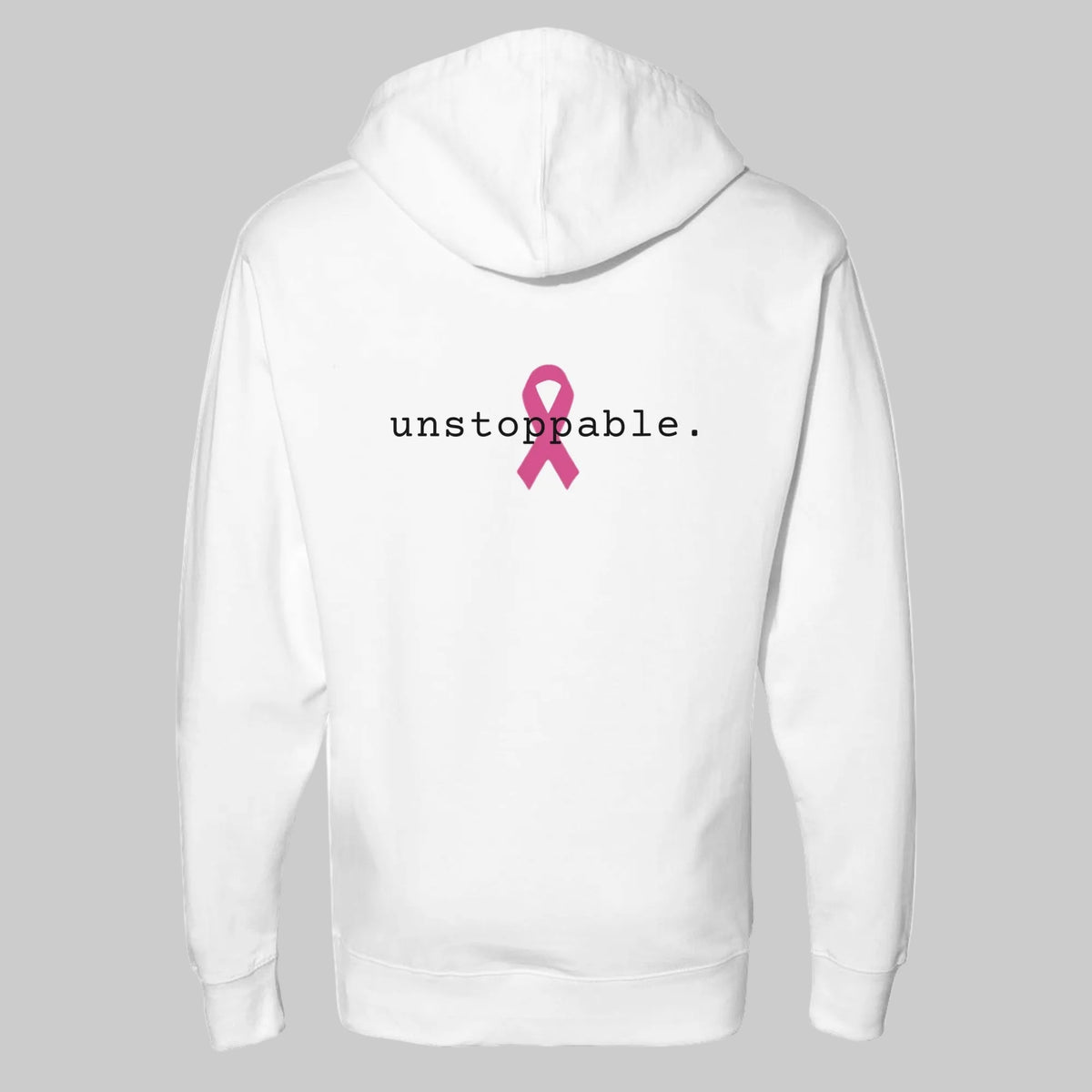 White pullover hoodie shown from the back, featuring the word 'unstoppable.' in black text and a pink awareness ribbon graphic centered on the back on a warm grey background