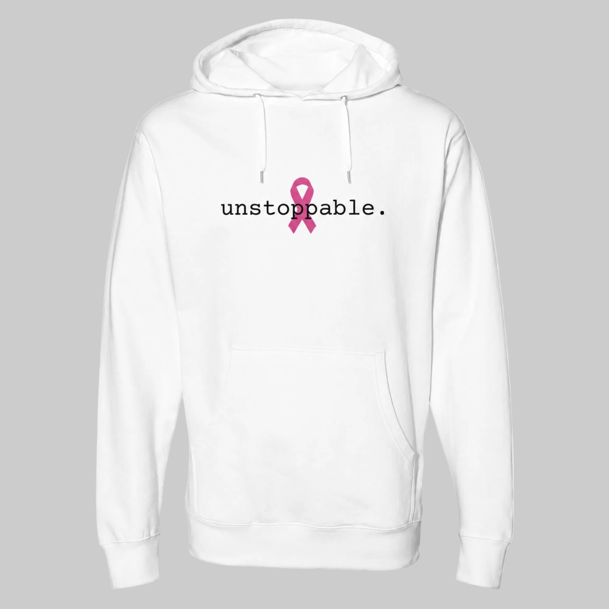 A classic white pullover hoodie with a pink ribbon graphic and the text 'unstoppable.' printed on the chest, displayed against a solid warm grey background.