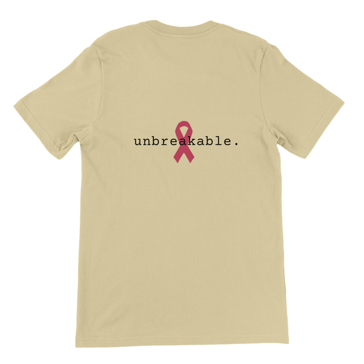 A natural-colored short-sleeve t-shirt shown from the back, featuring a pink awareness ribbon and the text 'unbreakable.' printed in black across the center.