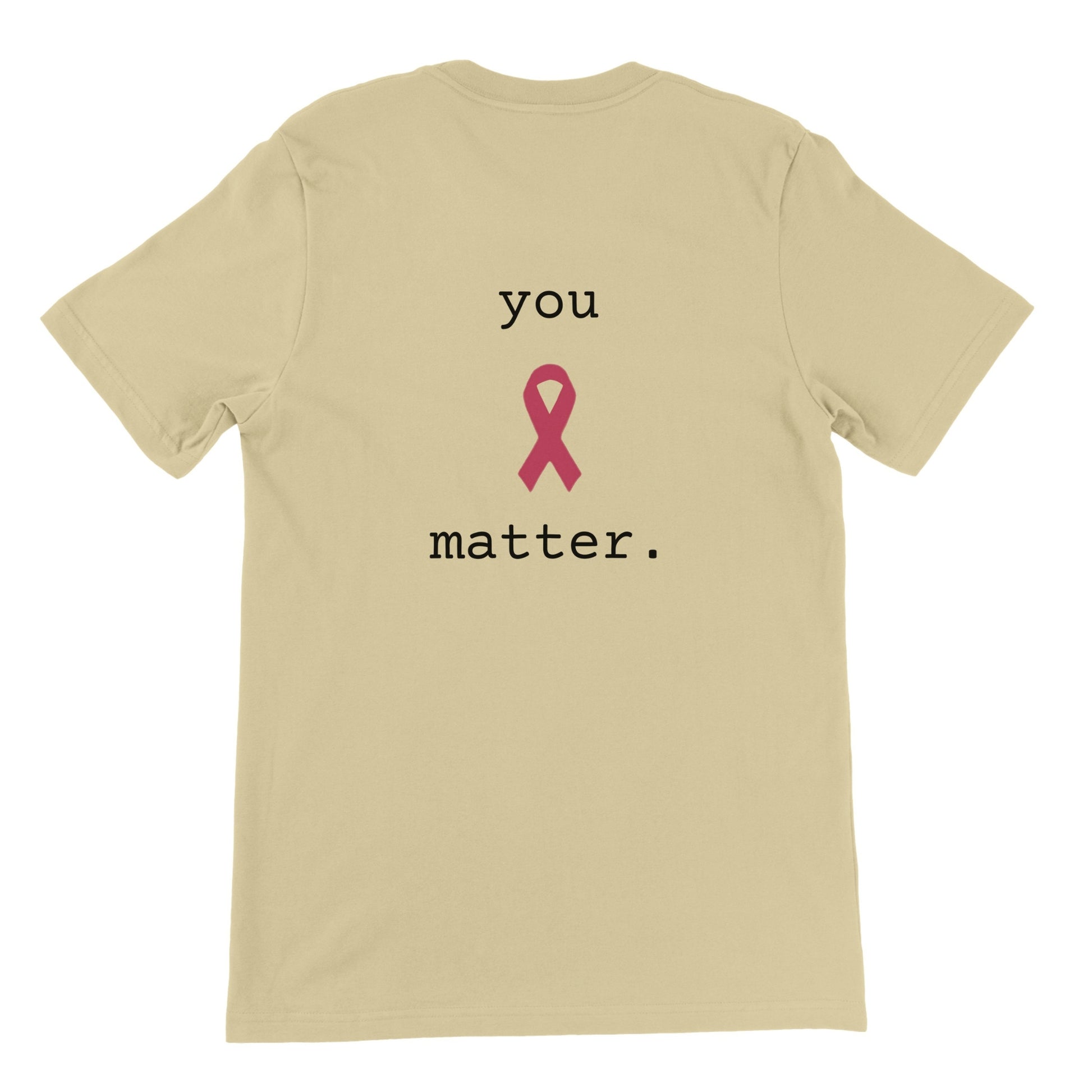 A natural-colored short-sleeve t-shirt shown from the back, featuring the printed text 'you matter.' in black with a pink awareness ribbon in the center.