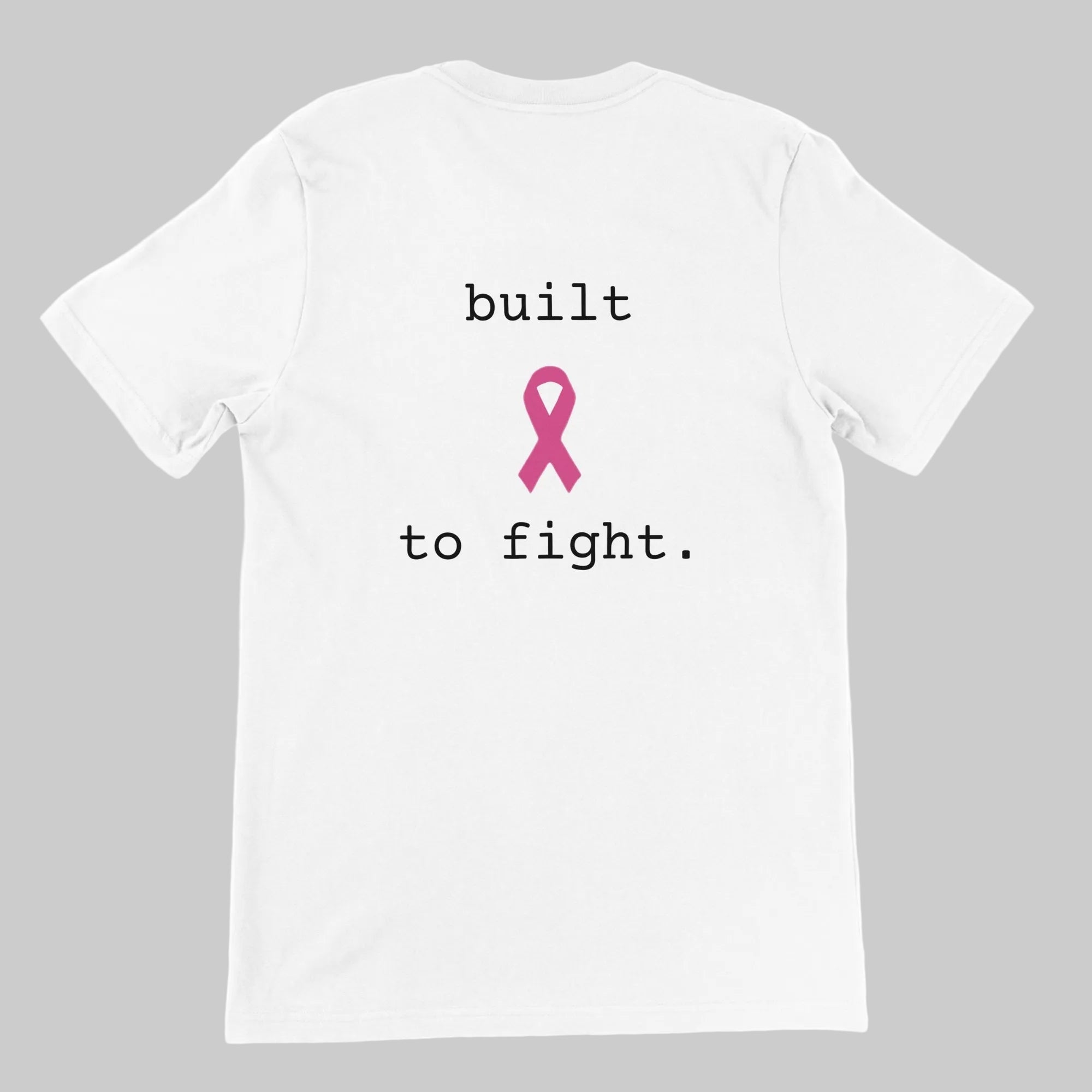 White short-sleeve T-shirt shown from the back with a pink ribbon graphic and the text 'built to fight.' printed in black on a warm grey background