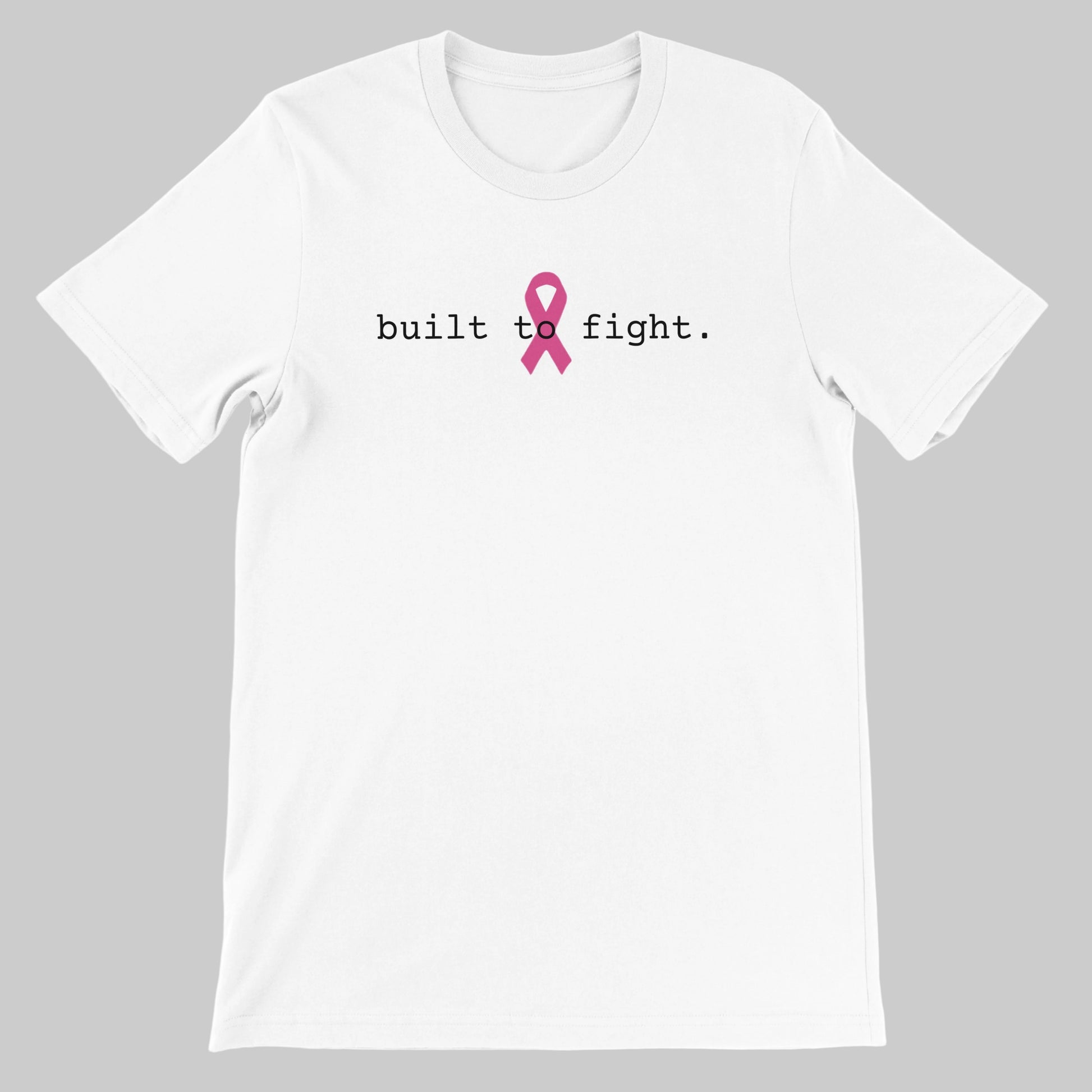 A white short-sleeve crewneck t-shirt with the text 'built to fight.' printed in black across the chest, centered around a pink awareness ribbon graphic on a warm grey background
