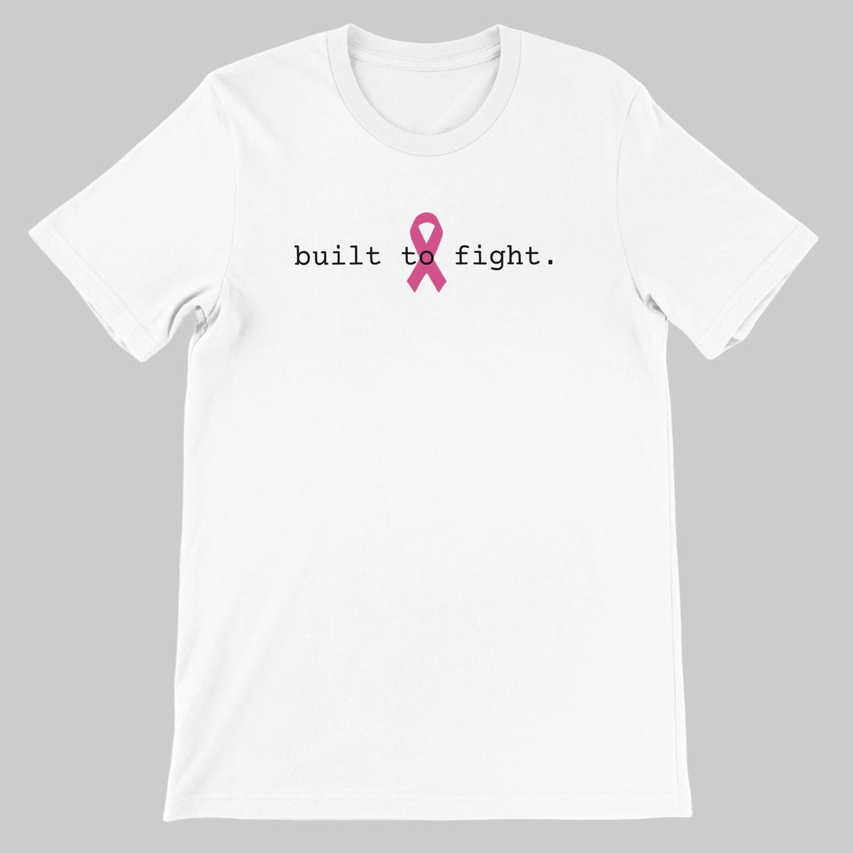 A white short-sleeve crewneck t-shirt with the text 'built to fight.' printed in black across the chest, centered around a pink awareness ribbon graphic on a warm grey background