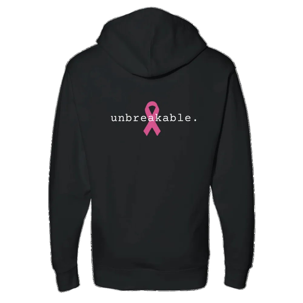 A black pullover hoodie shown from the back, featuring the word 'unbreakable.' in black lowercase letters next to a pink awareness ribbon graphic on a white background.